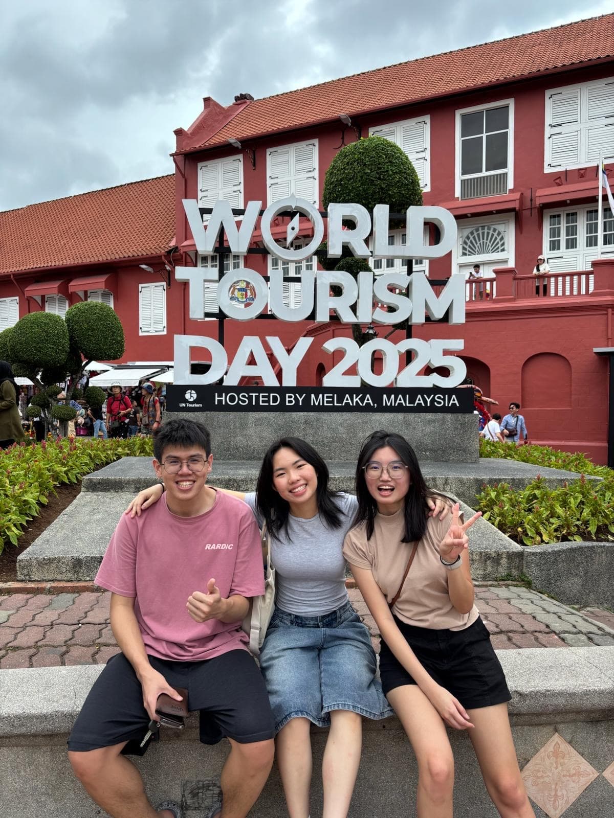 Students smiling during a penpal exchange
